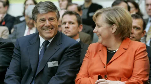 Josef Ackermann und Angela Merkel bei einer Veranstaltung.