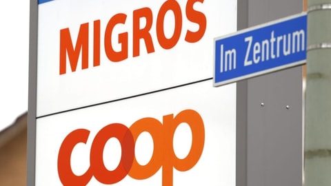 Migros- und Coop-Logo untereinander.