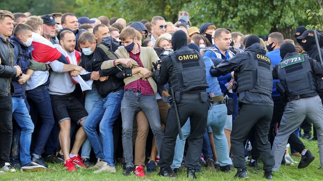 The protesters are being held by the security forces.