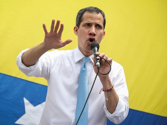 Guaidó speaks into the microphone.