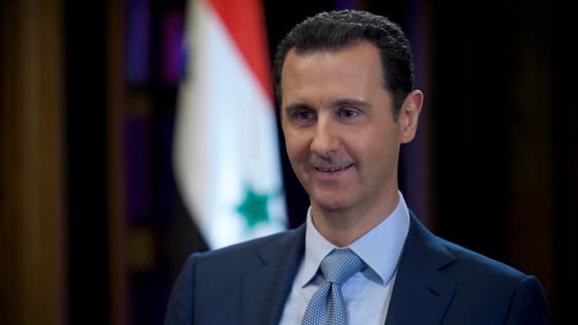 Ein Porträtbild von Syriens Präsident Baschar al-Assad