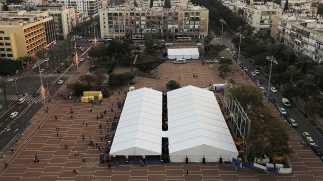 White tent in a square.