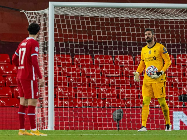 Liverpool goalkeeper Alisson Becker berates a defender