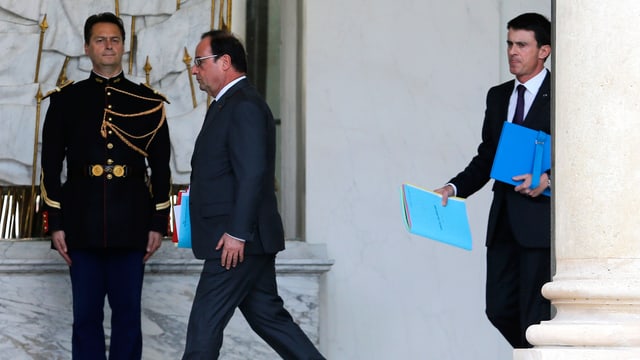 Präsident François Hollande gefolgt von Premier Manuel Valls.