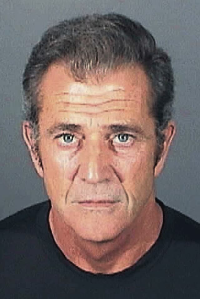 Mug shot of a man in a T-shirt.