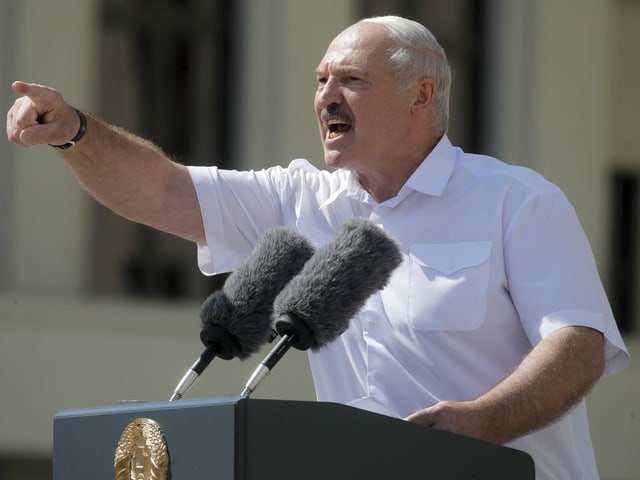 Lukashenko at the lectern.