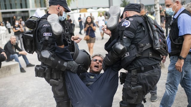 See the cops taking away a protester.