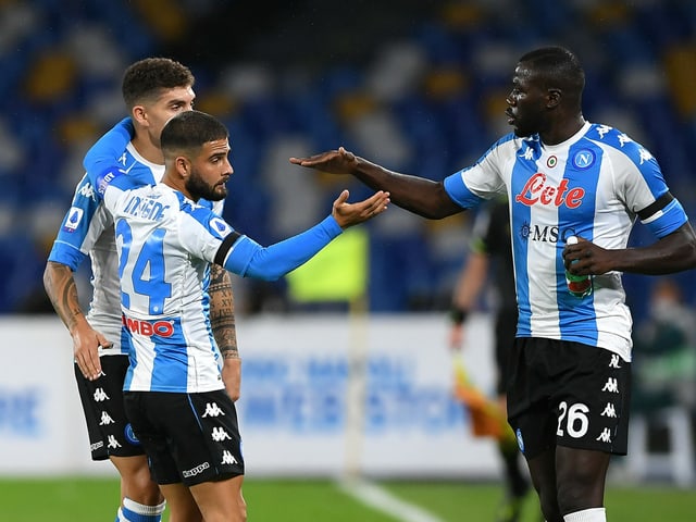 SSC Napoli players cheer on a goal.