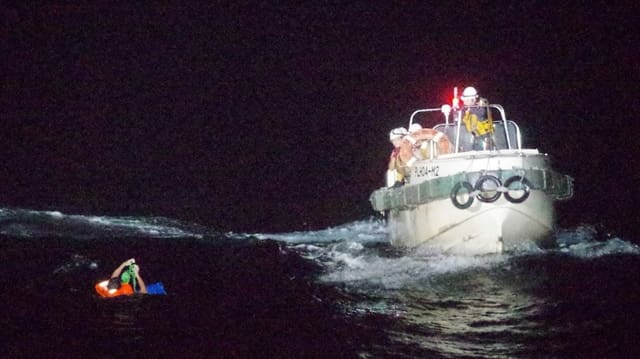 A member of the sunken freighter's crew is rescued by the coast guard.