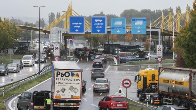 Cars wait at the border.