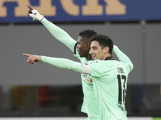 Lars Stindl and Breel Embolo celebrate the Swiss striker 1-0.