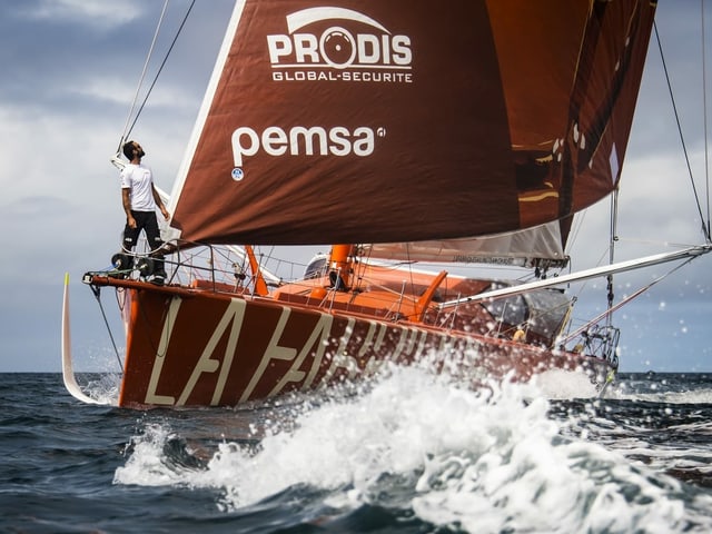 Alan Roura looks at his boat