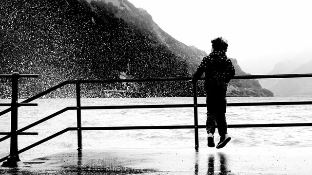 A child is splashed by the lake water.