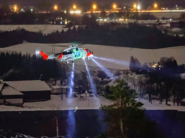 Helicopter in action at night.