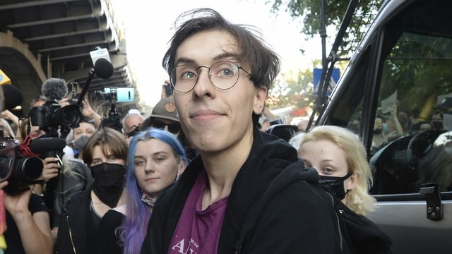 Activist Malgorzata Szutowicz, center, known as Margot, before being arrested in Warsaw, Poland, on Friday Aug. 7, 2020. LGBT rights activists scuffled with police Friday in Warsaw after turning out on the streets to protest the arrest of an an activist.