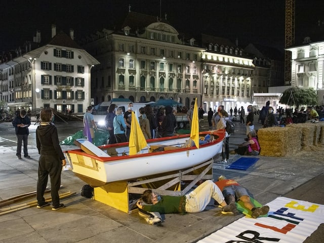 Climate activists with a boat on the Bundesplatz