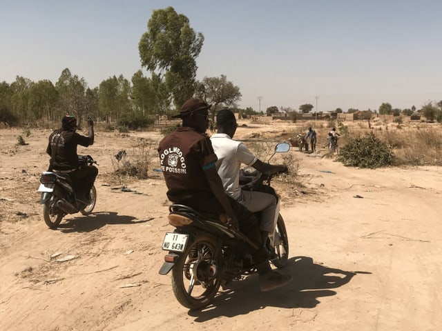 Männer auf Motorrädern