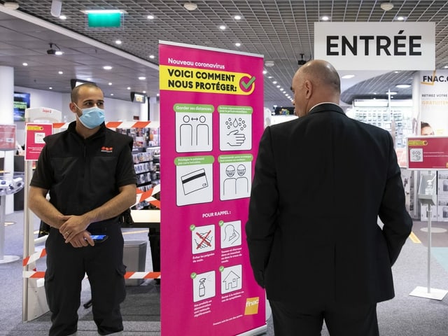 A man enters an electronics store.