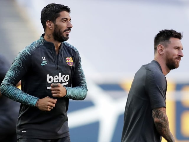 Luis Suárez (left) and Lionel Messi in training