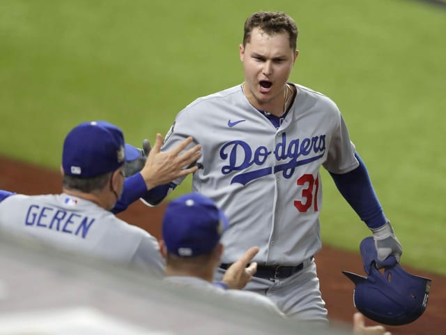     Joc Pederson applauds his teammates.