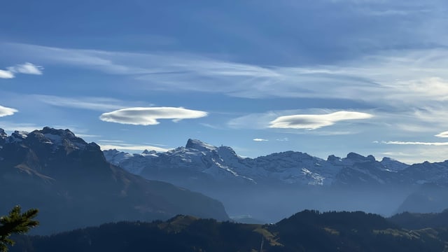 Lenticular clouds over the Alps.