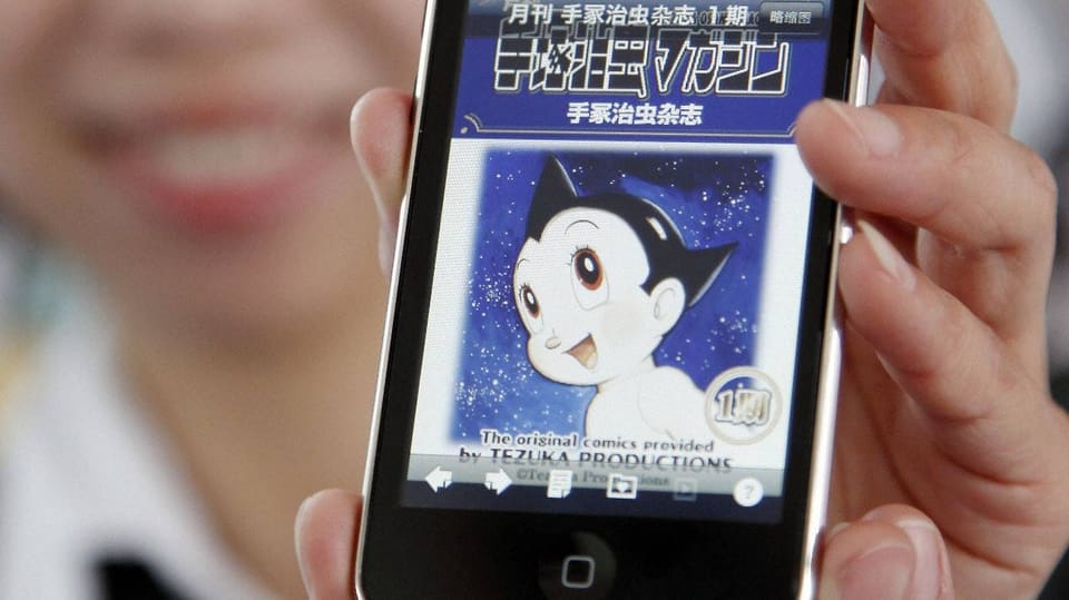 Die Manga-Comicfigur Astro Boy auf einem Handy-Bildschirm.