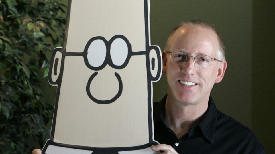 Scott Adams mit einem Pappaufsteller seiner berühmten Comicfigur «Dilbert»