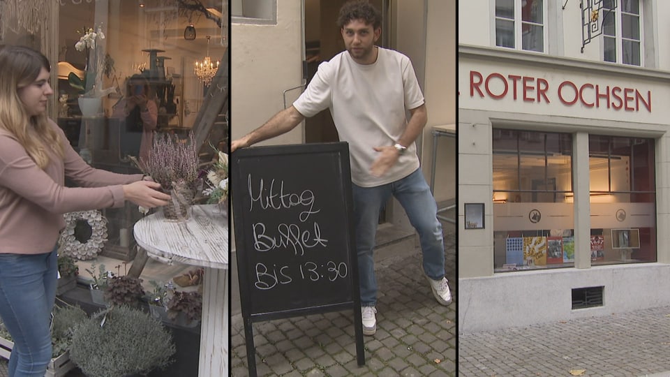 Frau arrangiert Blumen, Mann neben Menütafel, Restaurant Roter Ochsen.