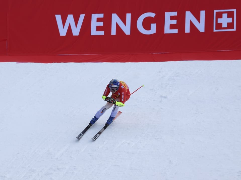 Skirennläufer unter Wengen-Banner.