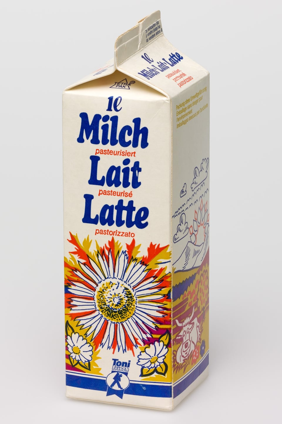 Milchpackung, auf der in drei Sprachen das Wort «Milch» aufgeschrieben ist: auf Deutsch, Französisch und Italienisch.