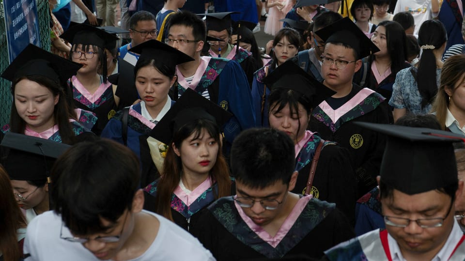 Graduierte mit den quadratischen Doktorhüten 