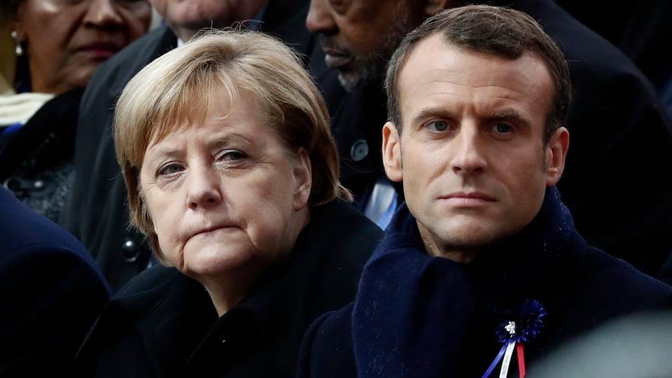 Gesichter von Merkel und Macron.