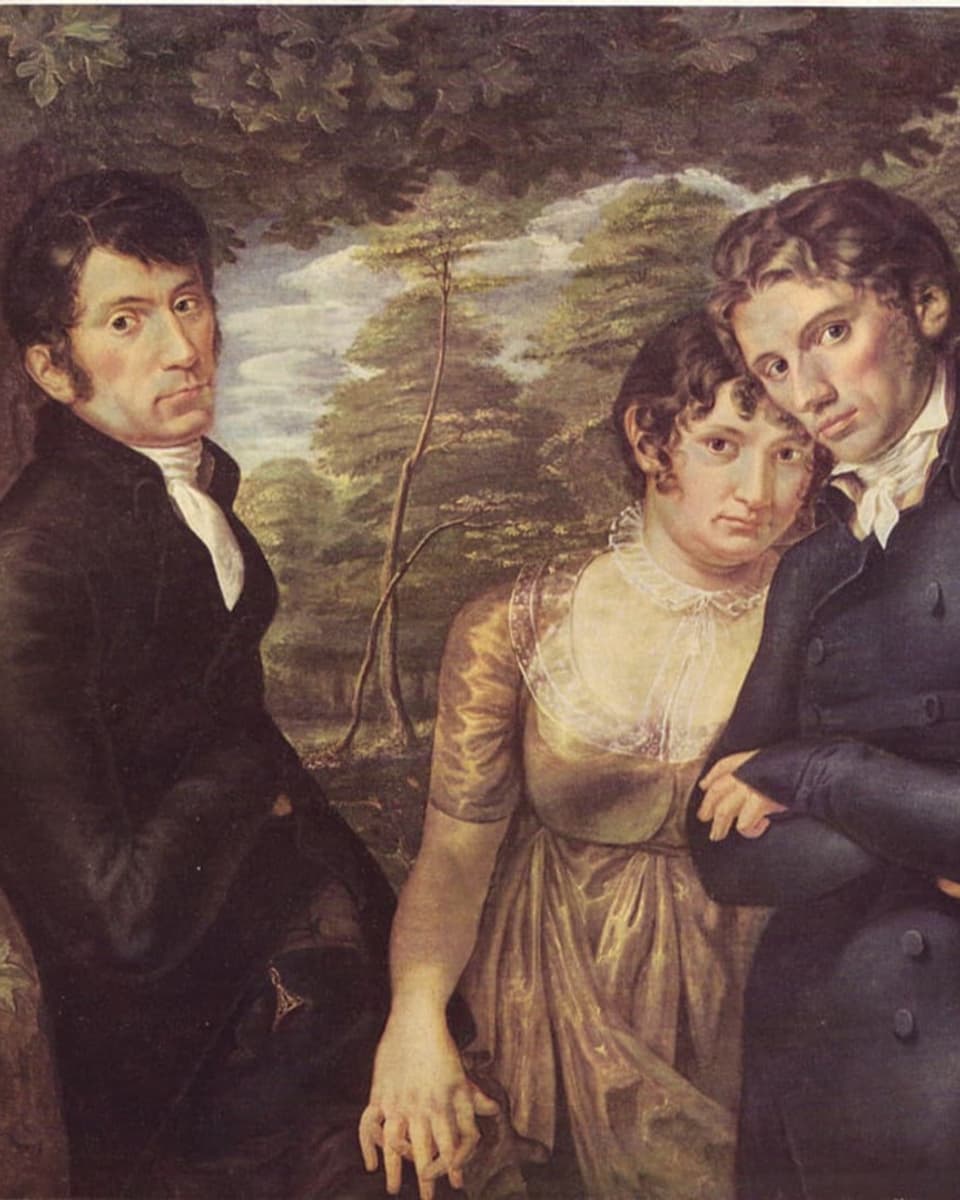 Bild von drei jungen Menschen, links ein Mann, hält Hand der Frau, Mann rechts wird von Frau umarmt.