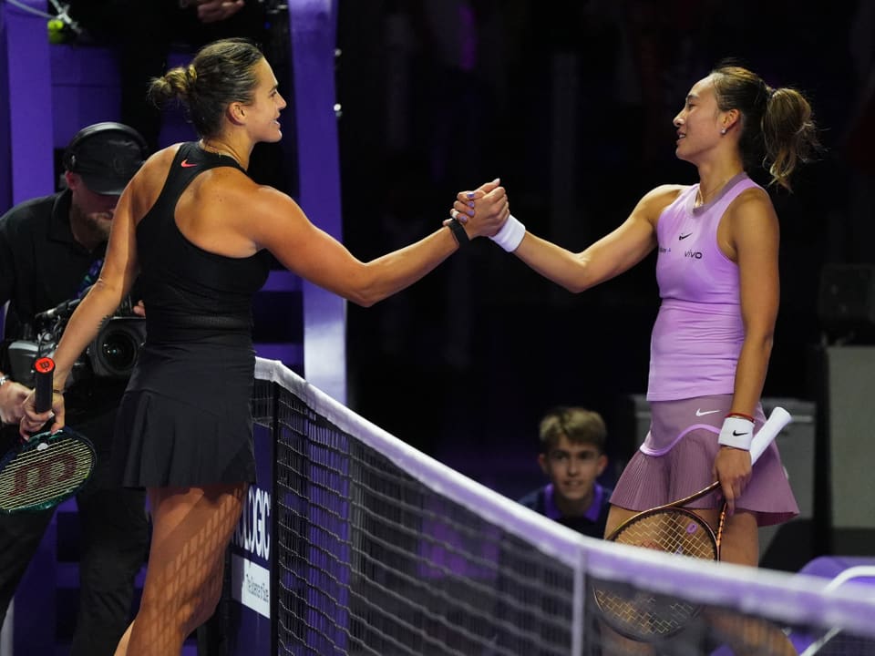 Handshake between Sabalenka and Zheng