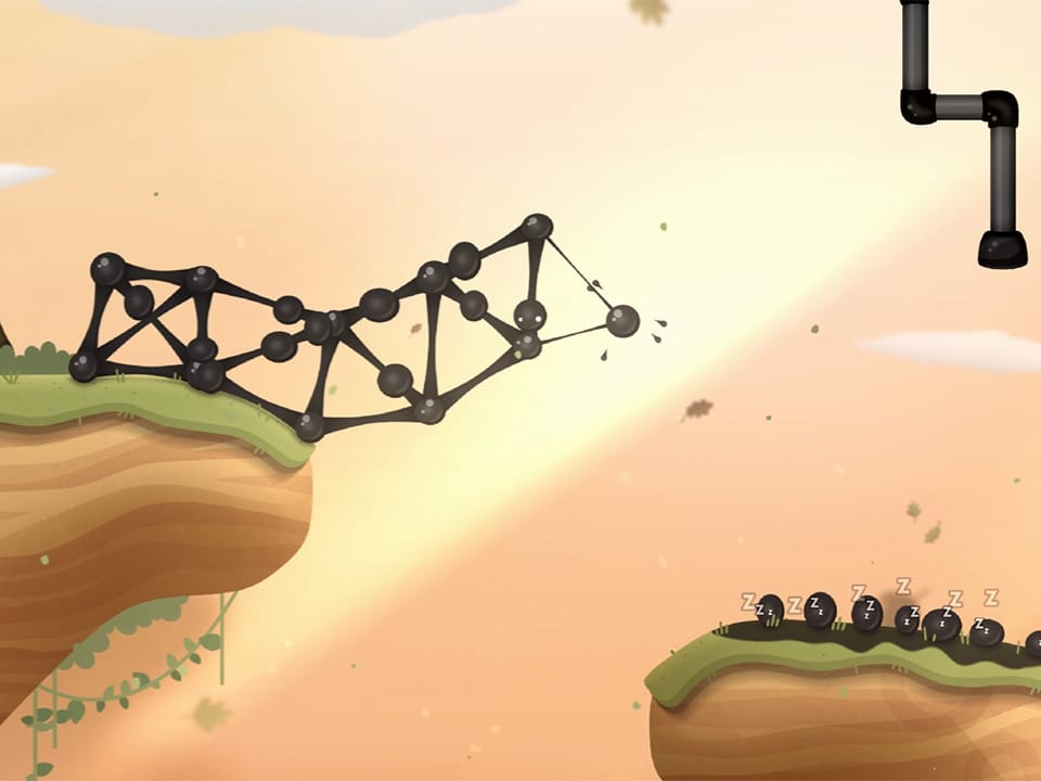 Szene aus dem Spiel: Schwarze Kugeln mit Augen formen eine Brücke zwischen zwei Vorsprüngen.